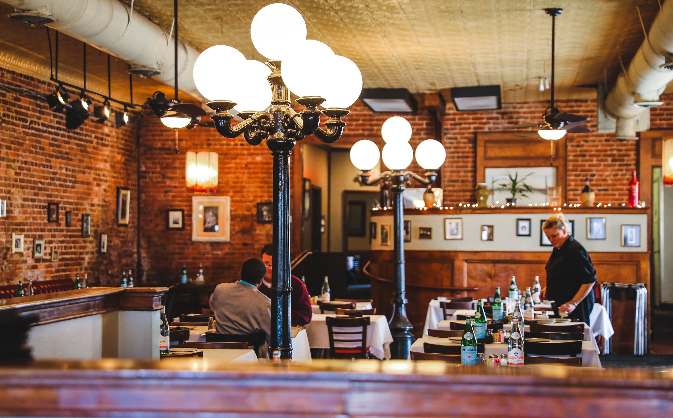 interior of italian restaurant with exposed brick walls