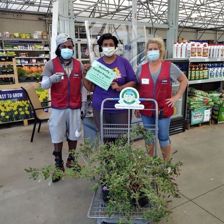 Lowes associates picking out butterfly plants