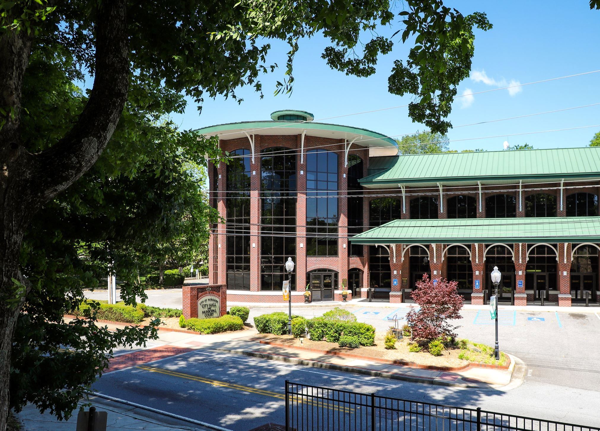 View of norcross city hall from behind trees
