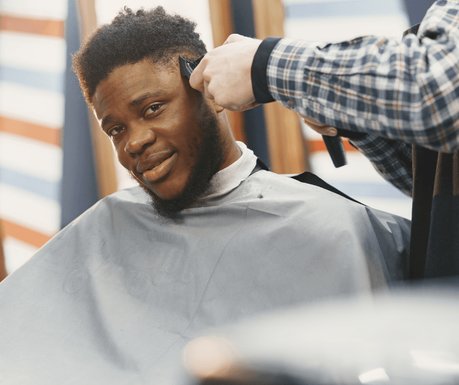 African American man getting his hair cut at the barber shop